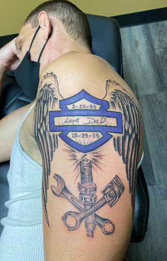 Explore tattoo flag ideas, creative tattoo ideas in Warner Robins, available at Untold Pain Tattoo Studio
