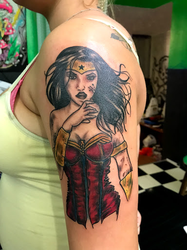 Explore thigh tattoo ideas for men, creative tattoo ideas in Hamilton, available at Glass Ink Tattoo