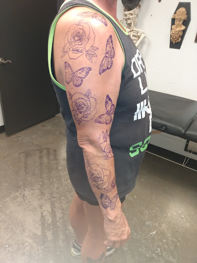 Find flower thigh tattoo ideas for your next unique tattoo in Oklahoma City at Skin Addiction Tattoo Studio