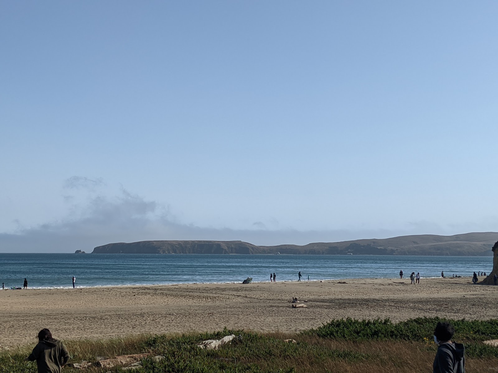 Foto av Drake beach - populär plats bland avkopplingskännare