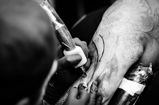 Explore love death and robots tattoo ideas, creative tattoo ideas in Mchenry, available at Art and Soul Tattoo Company