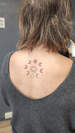 Find tattoo under breast ideas for your next unique tattoo in Fountain City at Innate Ink & Beauty