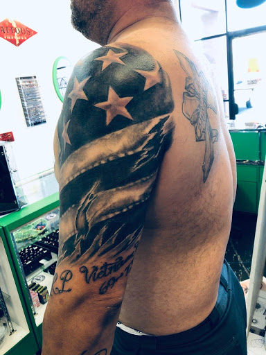 Explore weightlifting tattoo ideas, creative tattoo ideas in Redding, available at Caddy Daddys