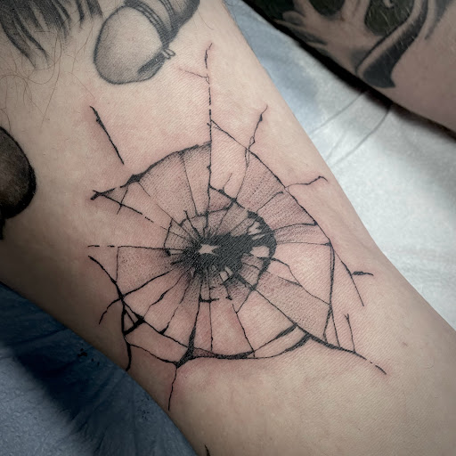 Explore punk tattoo ideas, creative tattoo ideas in Buffalo, available at True Gloom Tattoo Studio
