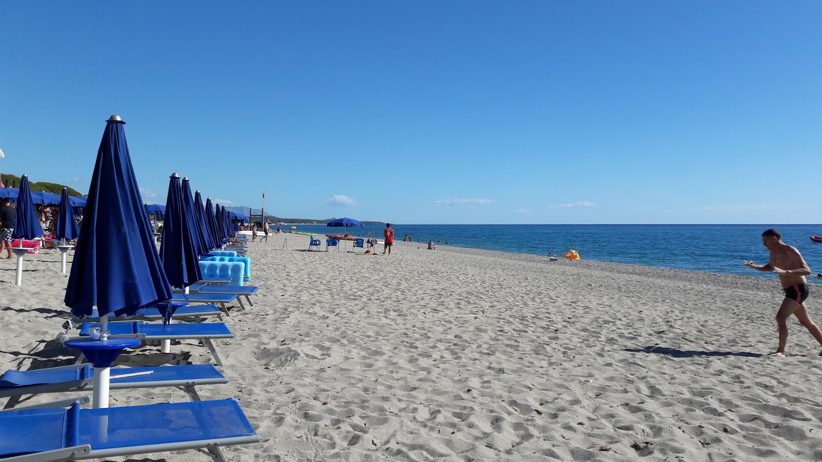Foto av Spiaggia di Foddini med turkos rent vatten yta