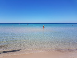 Foto van Spiaggia di Torre Lapillo en de nederzetting