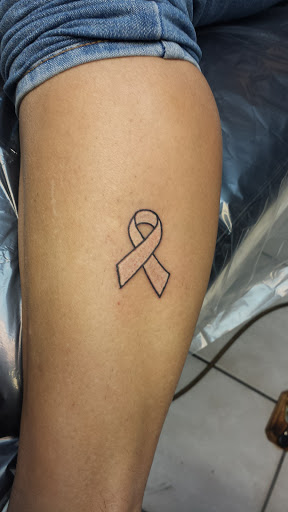 Explore back neck tattoo ideas, creative tattoo ideas in Bradenton, available at Memory Lane Tattoo Co.