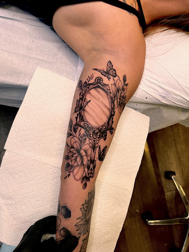 Explore butterfly flower tattoo ideas, creative tattoo ideas in Lockport, available at Archer Ink Tattoo