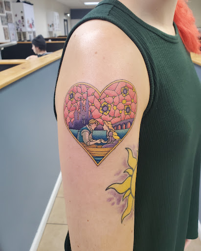 Find small tattoo between breast ideas for your next unique tattoo in Hatfield at Revelation Tattoo and Piercing