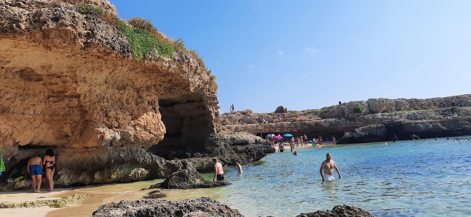 Grotta della Cala Tre Buchi'in fotoğrafı doğal alan içinde bulunmaktadır