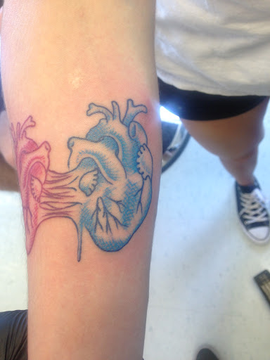 Explore elegant spine tattoo ideas, creative tattoo ideas in Kent, available at War Horse Ink