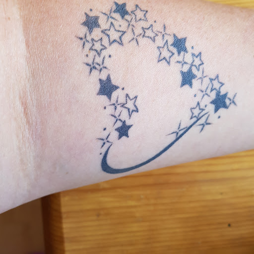 Explore mouse tattoo ideas, creative tattoo ideas in Katy, available at Artistic Impressions Tattoo Studio