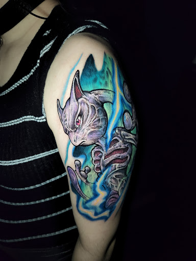 Explore thigh tattoos ideas for guys, creative tattoo ideas in Buford, available at Inked Arts Tattoo Studio