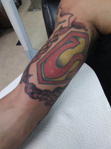 Explore leg tattoos ideas for men, creative tattoo ideas in Cranston, available at Kabloom Tattoo Studio