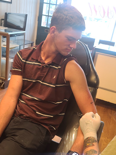 Find best friend memorial tattoo ideas for your next unique tattoo in Owosso at Crimson Tattoos