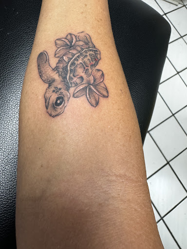 Explore foot print tattoo ideas, creative tattoo ideas in Panama City Beach, available at Oxygen Tattoo and Body Piercing Studio