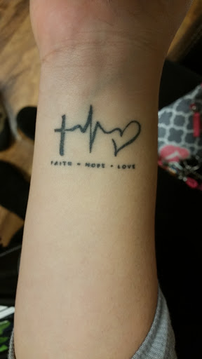 Explore mens hand tattoo ideas, creative tattoo ideas in Foley, available at Black Sheep Custom Tattoos and Piercings