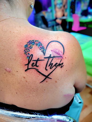 Explore ball python tattoo ideas, creative tattoo ideas in Benton, available at Spectrum Tattoo