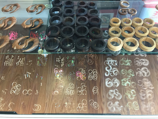 Explore purple flower tattoo ideas, creative tattoo ideas in Rockford, available at Euro Tattoo