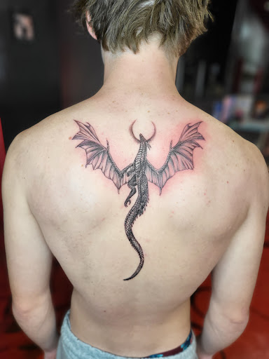 Explore dog collar tattoo ideas, creative tattoo ideas in Stuart, available at Kenny Tats Inkcorporated