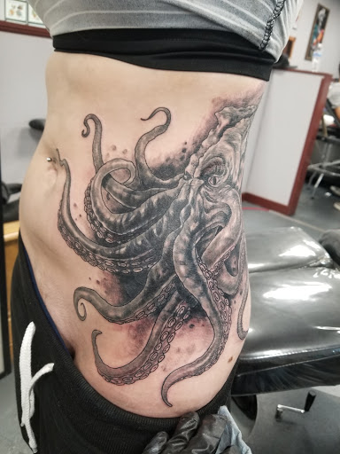 Explore pistol tattoo ideas, creative tattoo ideas in Glenwood Springs, available at Spyder Rose Tattoo