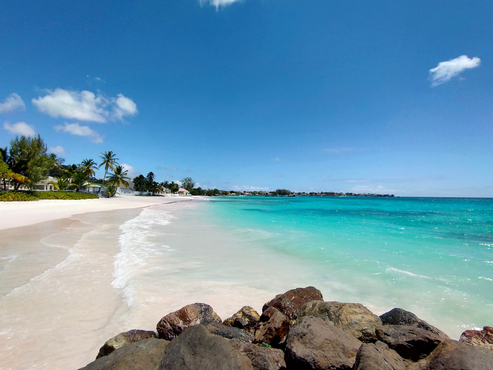Foto av Welches beach med fin beige sand yta