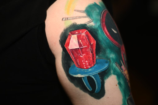 Explore cool cover up tattoo ideas, creative tattoo ideas in Broken Arrow, available at Geek Ink Tattoo and Piercings