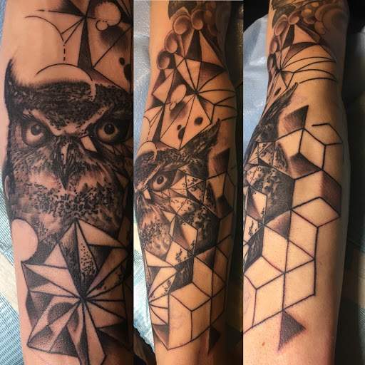 Explore ripped tattoo ideas, creative tattoo ideas in Milford, available at Golden Hammer Tattoo Studios