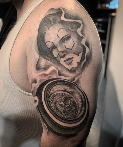 Explore afro tattoo ideas, creative tattoo ideas in Denver, available at Nocturnal Tattoo