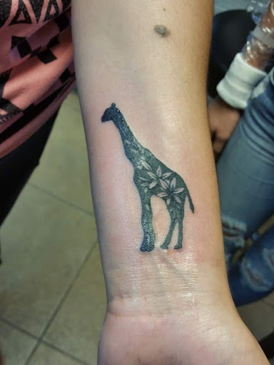 Explore dog love tattoo ideas, creative tattoo ideas in Elko, available at Custom Tattoos and Body Piercing Studio