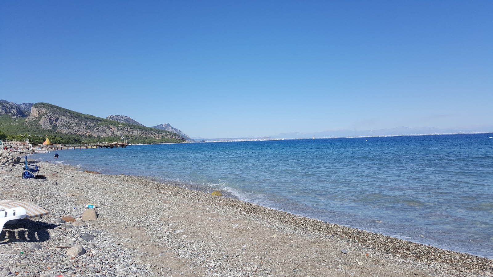 Foto av Beldibi beach med grå sand och småstenar yta