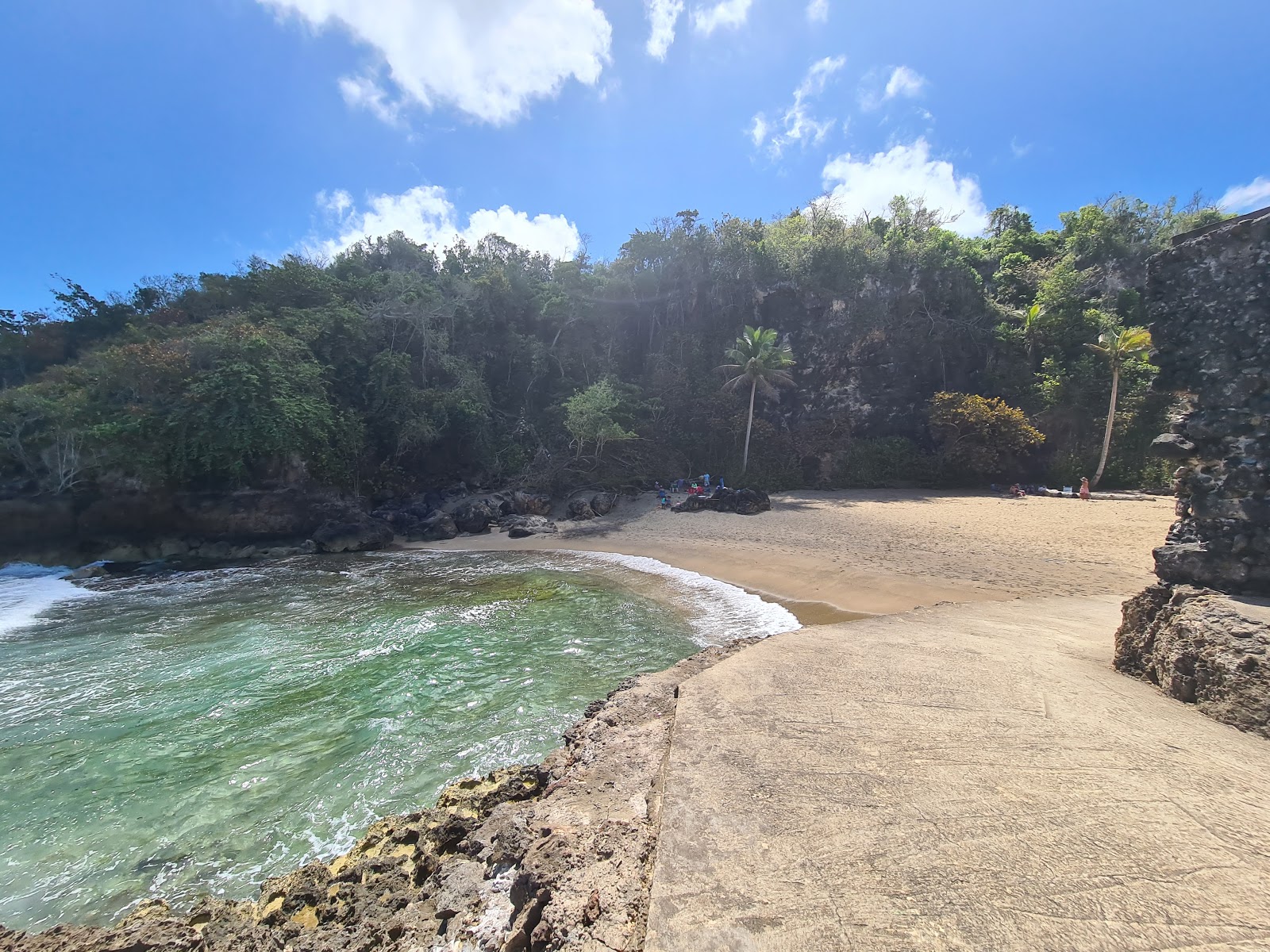Foto di Playa Puerto Hermina con una superficie del sabbia beige