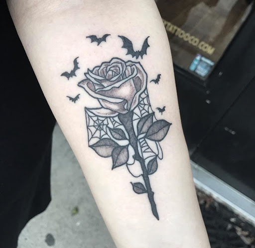 Explore cover up flower tattoo ideas, creative tattoo ideas in Middle River, available at Fidelity Tattoo