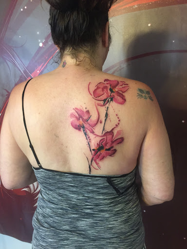 Explore tattoo cover up ideas on leg, creative tattoo ideas in Portland, available at Art Immortal Tattoo and Piercing