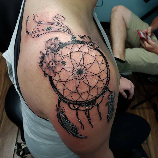 Explore dog bone tattoo ideas, creative tattoo ideas in Calhoun, available at A Sailors Grave Tattoo Parlor