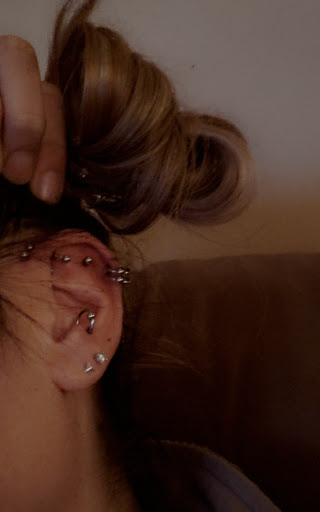 Explore inner ear tattoo ideas, creative tattoo ideas in Wake Forest, available at Revelation Ink Tattoo and Piercing