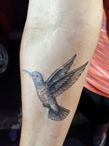 Explore traditional hand tattoo ideas, creative tattoo ideas in San Diego, available at Sideshow Tattoo and Piercing