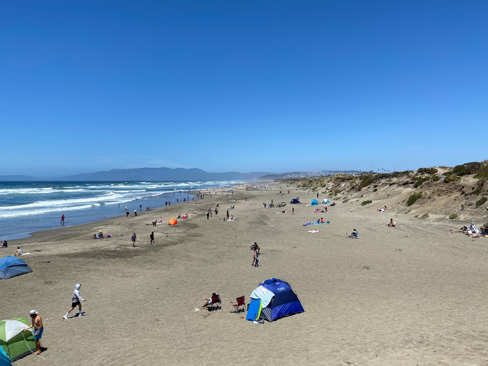 Foto van Ocean Beach met beige zand oppervlakte