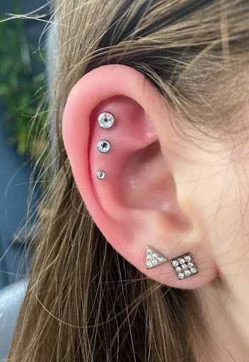 Find women's rib tattoo ideas for your next unique tattoo in Springfield at Body Piercing By Qui Qui