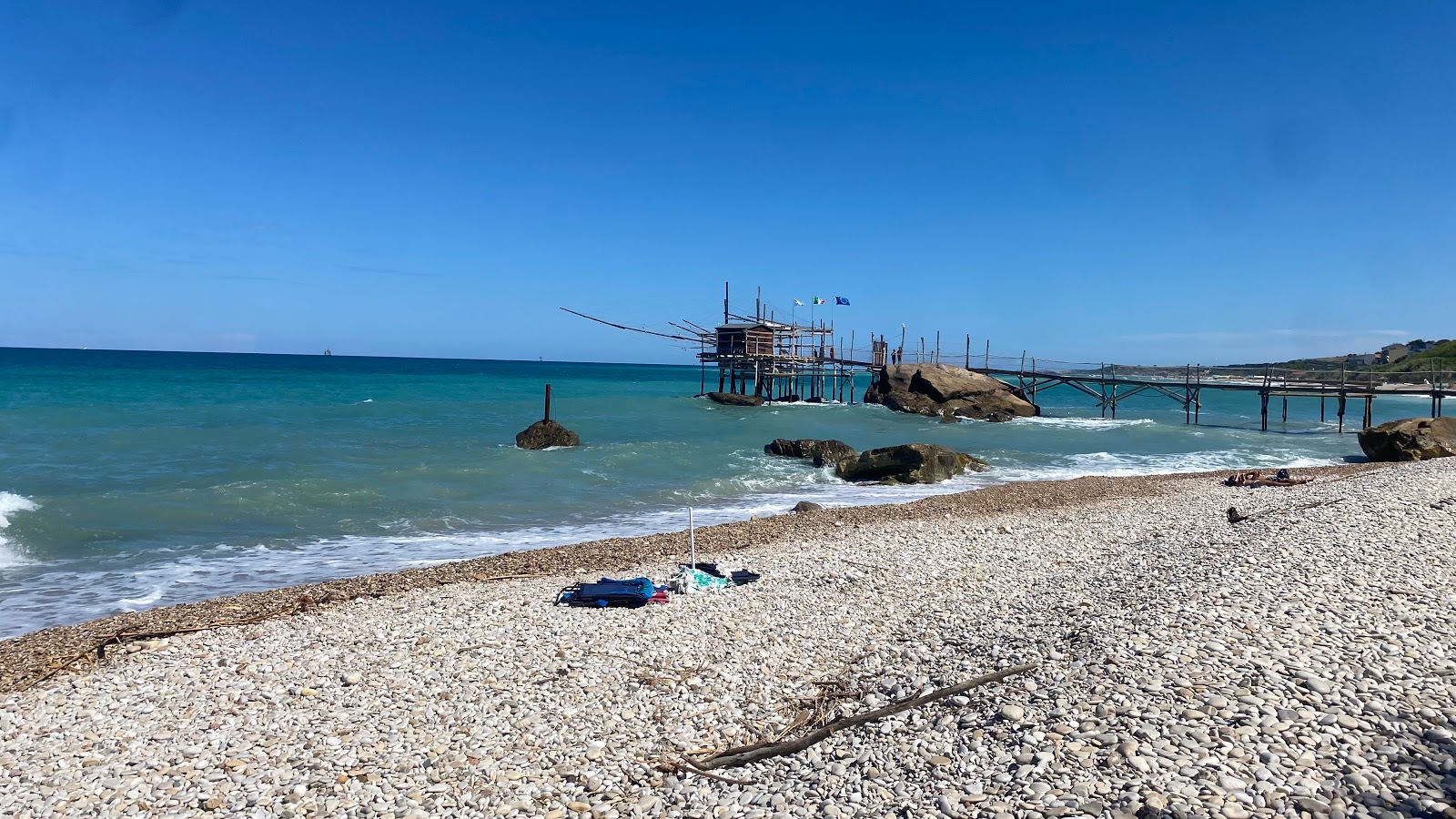 Fotografija Spiaggia della Fuggitella z modra voda površino