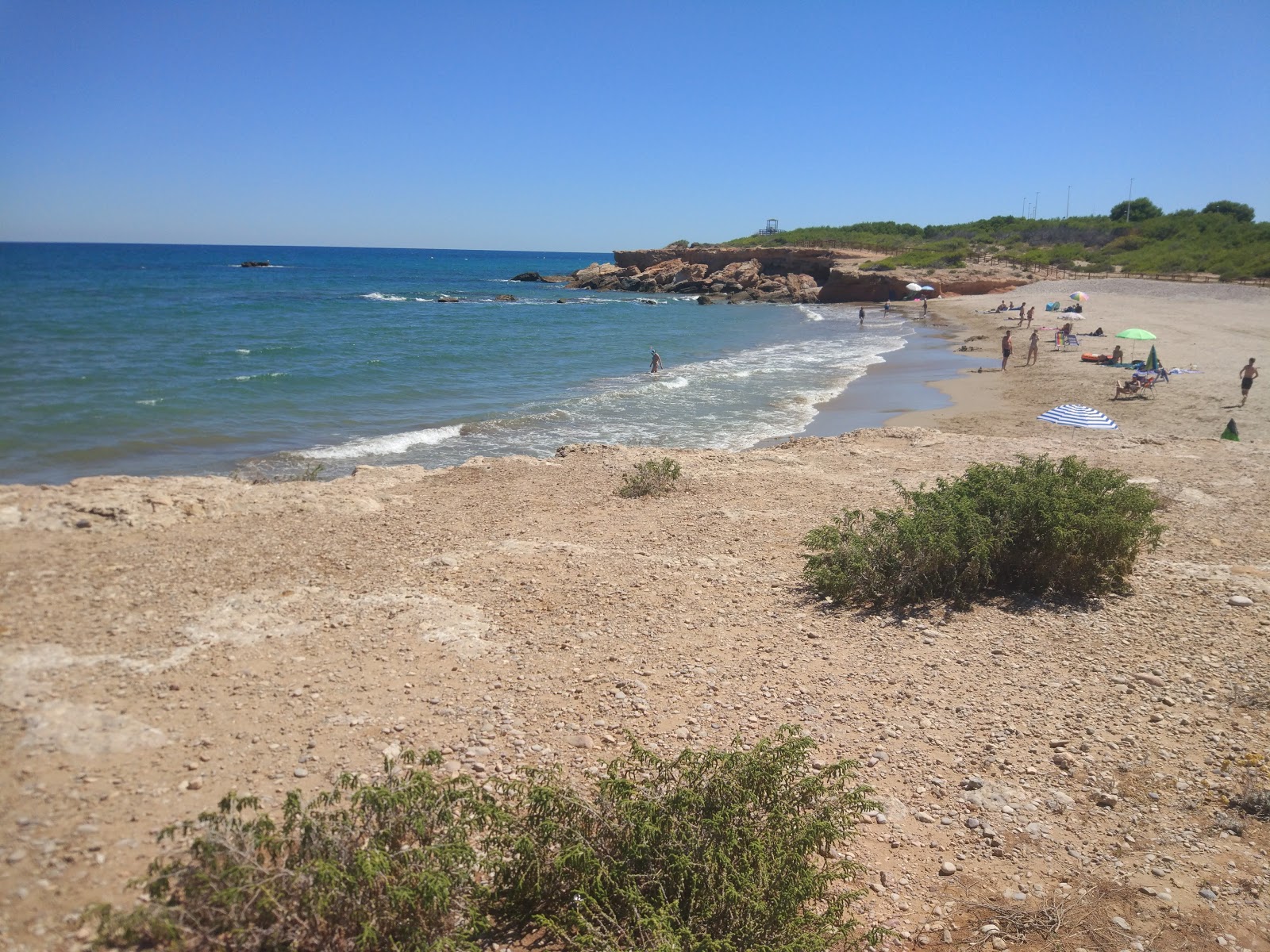 Foto van Playa del Moro met groen water oppervlakte
