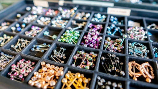 Explore women's lower back tattoo ideas, creative tattoo ideas in Charleston, available at Exotic Impressions Body Piercing