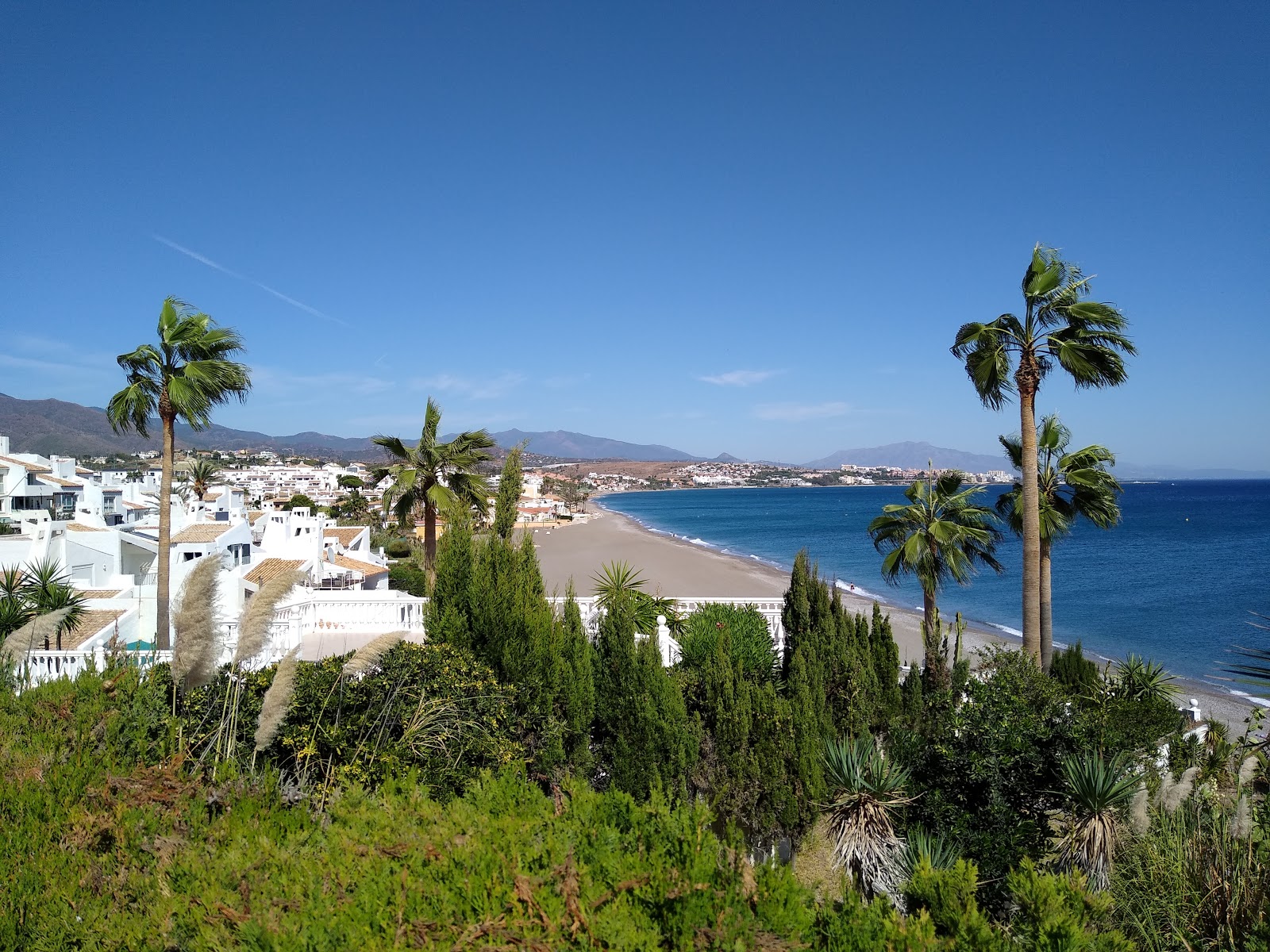 Foto di Playa Arroyo Vaquero S con una superficie del sabbia grigia