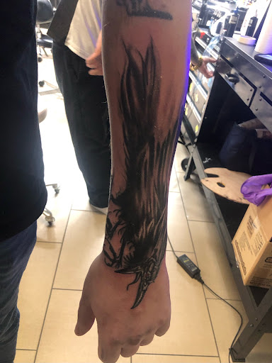 Explore marigold tattoo ideas, creative tattoo ideas in Sarasota, available at SEVEN SINS Tattoo Studio