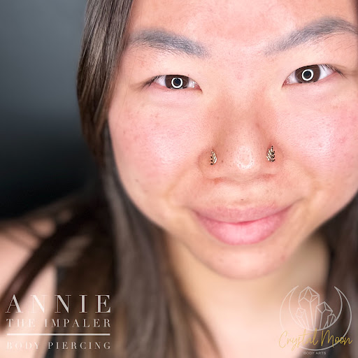 Explore lily flower tattoo ideas, creative tattoo ideas in Bloomington, available at Crystal Moon Body Arts