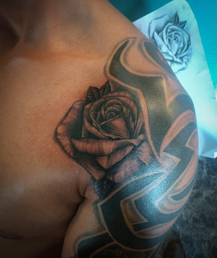 Find underboob tattoo ideas for your next unique tattoo in Lander at Blackblood Tattoo and Piercing