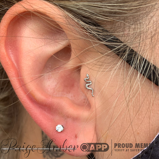 Explore smiley face tattoo ideas, creative tattoo ideas in Oshkosh, available at Piercings by Paige at Big Guns Tattoo