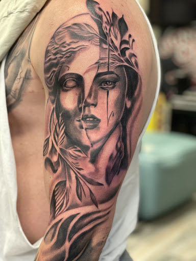 Explore butterfly spine tattoo ideas, creative tattoo ideas in Junction City, available at Junction City Tattoo