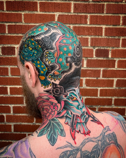 Find tattoo ideas for in between breast for your next unique tattoo in Strasburg at Champion Tattoo Company