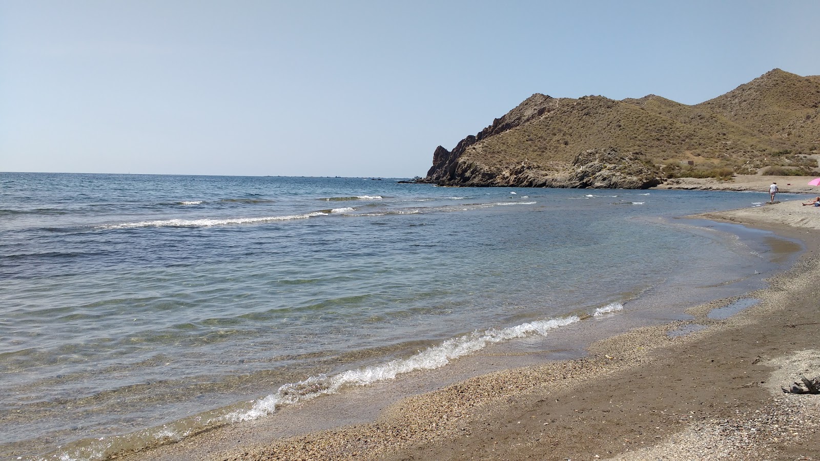 Foto di Playa del Arroz con parzialmente pulito livello di pulizia